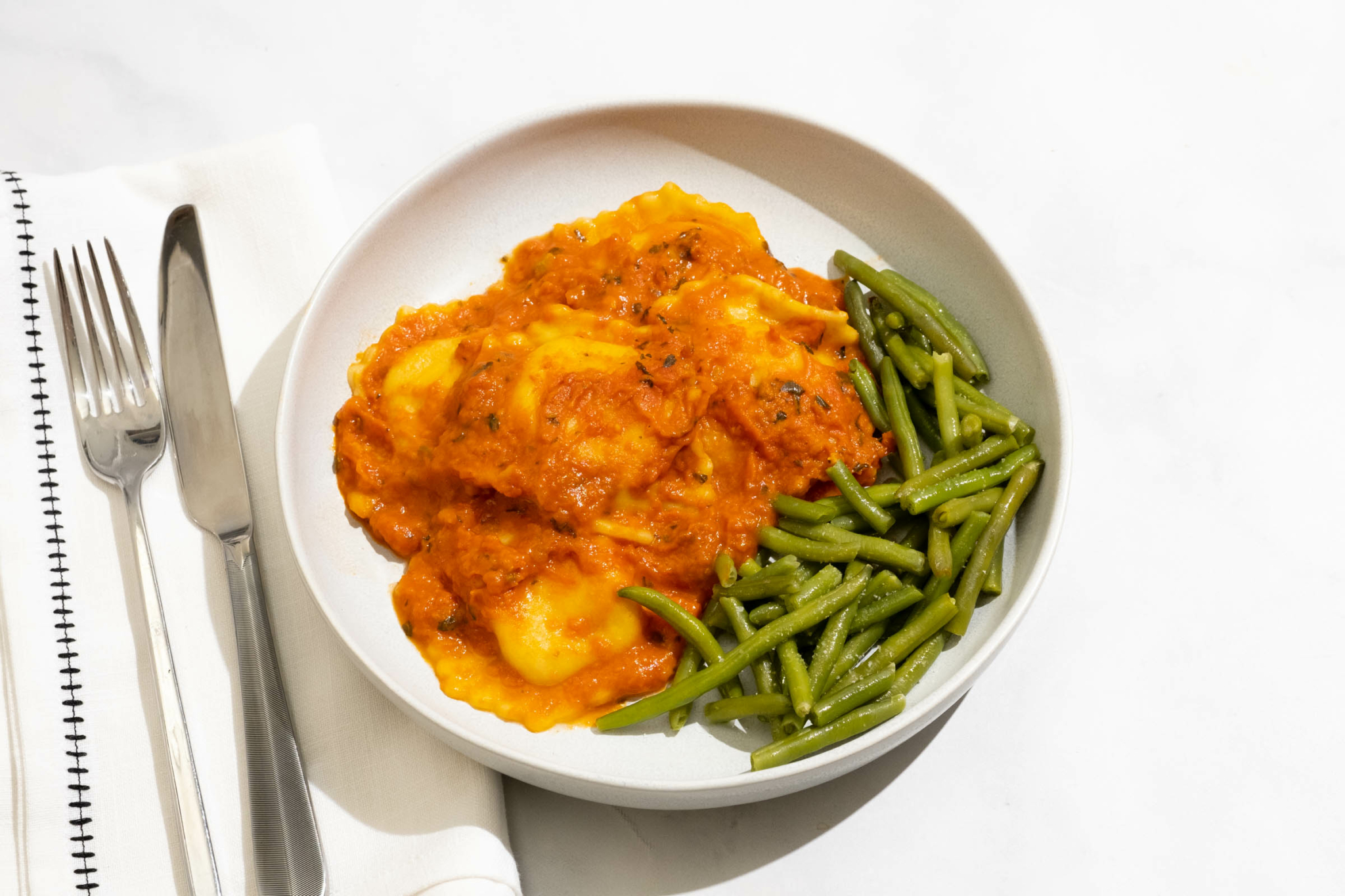 Meal Card Lobster Ravioli with Vodka Cream Sauce and Green Beans