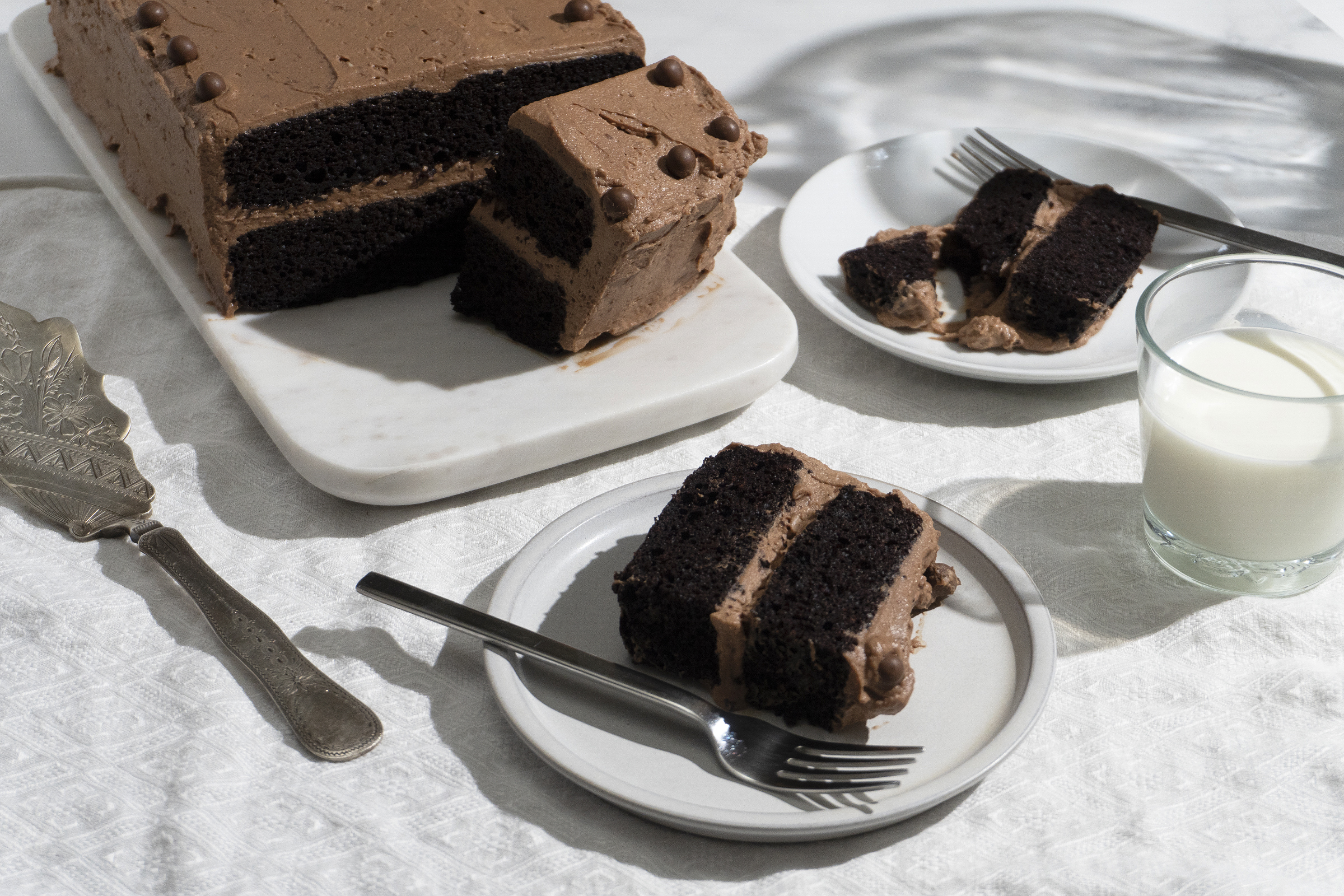 Premium AI Image | Tasty homemade chocolate cake near white brick wall